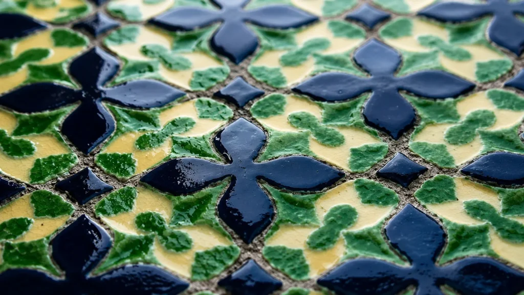 Raking light exposes the surface variation in handmade glazed tile