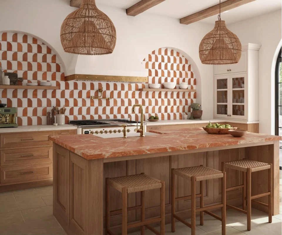 The island is a red marble Ive not seen used this way before, and its carrying the room more than the tile is.